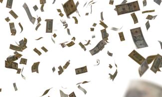a bunch of money flying through the air by Eyestetix Studio courtesy of Unsplash.